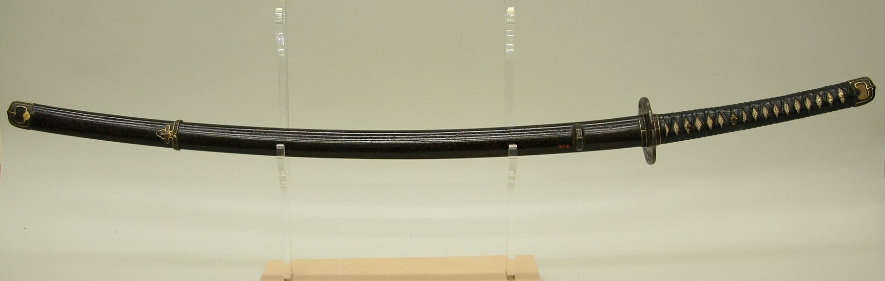 Japanese sword in shirasaya with calligraphy